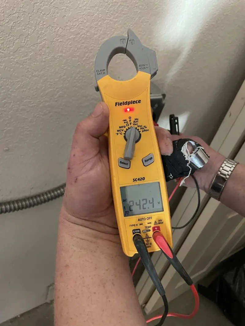 Voltage testing with clamp meter during Electrical Installation Services in Cazenovia